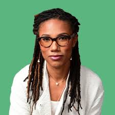 Amy Sherald uses portraiture to bring people of color—often neglected as  painting subjects—into art history. Here we see a young man, his skin and  attire mostly rendered in neutral tones of grey