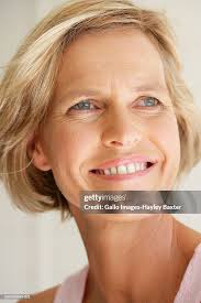 Mature Woman Smiling Closeup High-Res Stock Photo