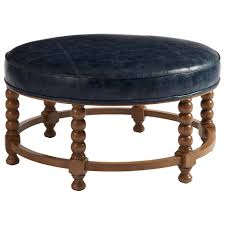 It's a chic coffee table and footrest for a family home. Barclay Butera Barclay Butera Upholstery 113799386 Naples Round Cocktail Ottoman With Spool Turned Base Baer S Furniture Ottomans