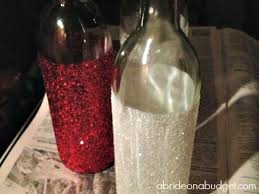 Upcycling empty and unwanted wine bottles into decorative table centerpieces will add more whimsy, sophistication and beauty to your event decor, and most are inexpensive and easy to. Glittered Wine Bottles Centerpieces A Bride On A Budget