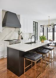 Black And White Quartz Kitchen Three Nuevo Chi Stools Are Placed At A Black Shaker Island Donning A White Quartz Countert Black Kitchen Faucets Black Kitchen Island Stools For Kitchen Island