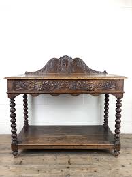 When console tables first became popular, it was not uncommon for people to use them as a hall table or buying a quality console table is a significant investment, expected to last for generations. Victorian Gothic Oak Side Table With Green Man Details The Penderyn Furniture Co