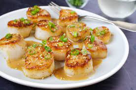 It's all in the sauce. Recipe Miso Ginger And Sake Form A Sauce Rich In Umami For Sauteed Sea Scallops The Boston Globe Scallop Recipes Recipes Japanese Scallops Recipe
