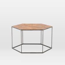 The hexagonal caviar black and beige coffee table features a graphical shape that comes alive with the contrast between oak in its pale natural state and in caviar black finish inspired by french chevron parquets, there is a classic feel to graphic shape with a modern take. Faceted Wood Hexagon Coffee Table