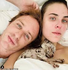 Tallulah Willis poses in a floral bikini with boyfriend Dillon Buss