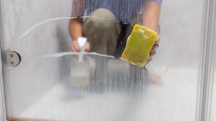 Citric acid or vinegar dissolves hard water scale on glass screens, AI generated
