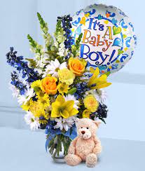 The baby boy bouquet blends solidago, yellow gerbera, yellow spray roses, white daisies, and eucalyptus with lush blue hydrangea and a festive it's a boy pick. Baby Boy Flower Arrangement 1 Florist