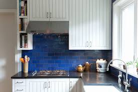 White kitchen and blue backsplash. White Kitchen Cabinets Blue Backsplash Kitchencabinetsblue Blue Kitchen Tiles Mosaic Tile Kitchen Blue Glass Tile