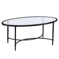 Our beverly coffee table is hand woven of natural rattan with lattice apron, wrapped joints and tempered glass top. Southern Enterprises Quinton Oval Glass Top Cocktail Table In Black Ck3600