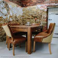 Set of 4 urban style leather dining chairs with solid wood legs chair. Plank Wood Dining Table Leather Chairs Set From Curiosity Interiors