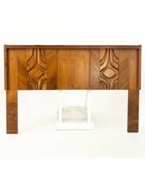 The headboard has a slatted design that adds a touch of farmhouse style to this sleek frame. Canadian Brutalist Mid Century Walnut Queen Headboard