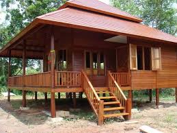 Modern Nipa Hut Has Already Taken Different Designs But Living Or Staying In A Modern Day Bahay Kubo Whil Wooden House Design House On Stilts Wood House Design