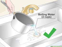 If you have a clog in your bathroom sink or tub, nelson recommends filling the basin with hot water and then unplugging the sink's drain to (hopefully) flush the drain out to clean the drains. 5 Ways To Clean A Drain Pipe Wikihow