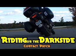 riding on the darkside car tire on a motorcycle contact patch