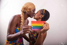 Two African Lesbian Girls Kiss And Hold Rainbow Flag, Same Sex Girlfriends  Stock Photo, Picture and Royalty Free Image. Image 186805574.