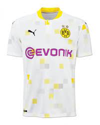 The slick black jersey features continuous lateral chevron graphics in steel grey with black shorts and socks. Borussia Dortmund 2021 22 Third Kit
