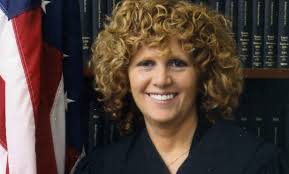 Claims Narrowed in Defamation Suit Against Napolis and Firm