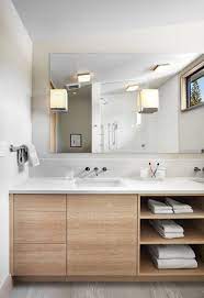 Choose wooden cabinetry with metal or pipe detailing to make the look. 15 Examples Of Bathroom Vanities That Have Open Shelving