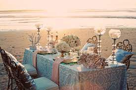 The fall wedding decorations can be simple with colored leaves at each place setting or more elaborate decorations to coordinate with the wedding colors and natural beauty of autumn. Blue Wedding Reception Table Setting On The Beach