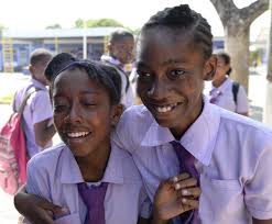 Jamaica GleanerGallery|GSAT Results 2015 |Jermaine Barnaby/Photographer  Tears of joy flow down the cheeks of Rhyanna Bellnavis (left) who passed  for Wolmers and Karo-Lee Briscoe who passsed for St. Andrew High following  the