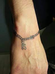 Pin By Jeaniink On Tats Wrist Bracelet Tattoo Tattoo Bracelet Charm Bracelet Tattoo