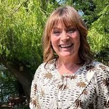 Lorraine Kelly beams in photo from garden as she tells fans 'on the mend'  following surgery