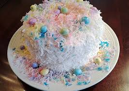 Spoon cake into dessert bowls; Recipe Of Award Winning Coconut Cake With Colored Coconut Decorations For Any Holiday Great Recipes Ideas
