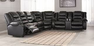 Our locally owned and operated stores are passionate about being the best and most affordable furniture store for your home. Ashley Furniture 79308 88 77 94 3 Pc Vacherie Black Faux Leather Sectional Sofa With Recliner