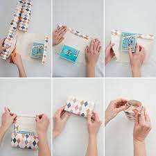 Next, pop open your gift bag and trip the top if needed, leaving enough room to fold the edge down to close. Gift Bags From Wallpaper Gift Bags Diy Diy Gift Bags From Wrapping Paper Gift Bags