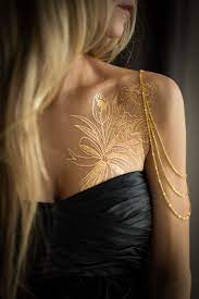 Flash tattoo are very popular these days, especially those that come in metallic colors! Vibrant Temporary Tattoos Designed By Famous Artists Who Ink Permanent Body Art Gold Tattoos Permanent Metal Tattoo Gold Tattoo