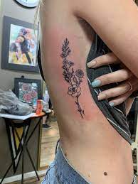 Rib Cage Flower Tattoo Larkspur And Daisy S Rib Tattoos For Women Girly Tattoos Lavender Tattoo