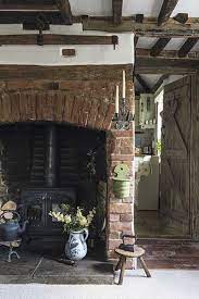 traditional cottage brick inglenook fireplace and woodburner rustic cottage interiors cottage fireplace thatched cottage