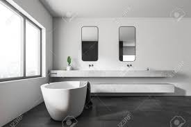 Shop mosaic tiles and create feature designs around your shower. Side View Of Modern Bathroom With White Walls Black Tiled Floor Large Window White Bathtub And White Stone Double Sink With Vertical Mirrors 3d Rendering Stock Photo Picture And Royalty Free Image
