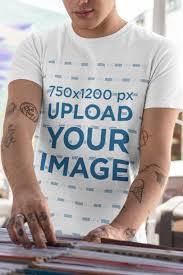 Placeit T Shirt Mockup Featuring A Man With Tattooed Arms At A Music Store In 2020 Shirt Mockup Tshirt Mockup Mockup Design