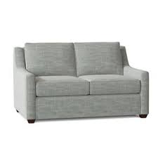 Designed with the traditional chesterfield style in mind, this velvet armchair hits all the key elements, with deep button tufting, nailhead accents, scrolled arms, and turned wooden legs. Camel Back Sofa Birch Lane