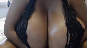 Ebonybrabustergee shows off her titanic juggs in this video