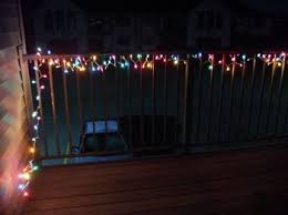 Colored Christmas Lights Wrapped Around Deck Railing In Backyard Colored Christmas Lights Deck Lighting Deck Railings