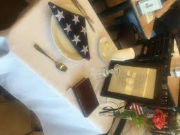 12 silk rose with 6 glass vase & red ribbon. Missing Man Table Recognizes Servicemen And Veterans Chick Fil A