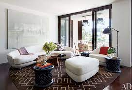 Large ottoman / coffee table decorative trays. How To Incorporate Ottomans Into Your Living Room Decor Architectural Digest