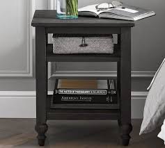 Round night stand with draped clothing item. Astoria 18 Nightstand Pottery Barn