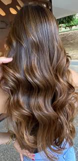 I have naturally dark brown hair with warm undertone so some reddish hue comes through in the light. Best Hair Colours To Look Younger Toasted Almond Brown Hair