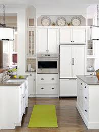 Keep enough dishes in your kitchen to feed your family or a before you arrange your dishes in your kitchen cabinets, separate your dishes into categories and discard place cooking tools, like spatulas and wooden spoons, in a caddy next to or above the stove. Ideas For Decorating Above Kitchen Cabinets Better Homes Gardens