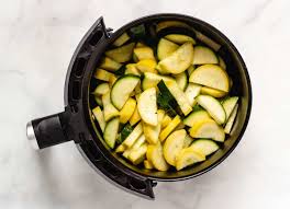Carefully remove the first layer of zucchini from the basket (using tongs) and place them on a large. Air Fryer Squash Zucchini And Yellow Squash Recipe Keeping The Peas