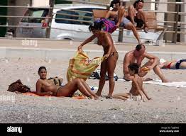 Nereida Gallardo Enjoying her holiday sunbathing topless on the beach and  playing in the surf. Majorca, Spain 22.07.08 Stock Photo - Alamy