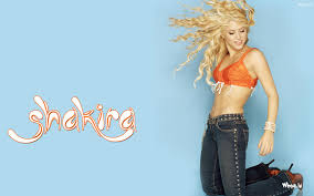#blue #shakira l #bluemangrouponlyfans here: Wallpaper Of Shakira With Orange Top On A Blue Background