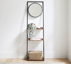 Frame is metal, shelves are solid wood. Trenton Ladder Shelf With Mirror Pottery Barn