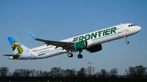 Frontier Airlines aircraft flying in the sky, symbolizing air travel and flexible flight options.