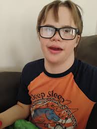This is my son Benjamin. He has Down Syndrome and is 16 years old. He was  born with 2 wholes in his heart that closed up but now has a leaking valve