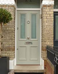 The aqua front door here is bold, while the underside of the porch roof and the roof overhangs suggest blue sky. Victorian Wood Front Door