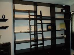 Wall Of Bookshelves With A Rolling Ladder On The Cheap Rolling Ladder Wall Bookshelves Bookshelves Diy